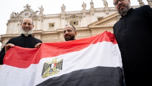 Coptic priests with flag of Egypt