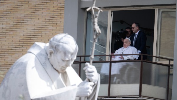 Pope Francis waves from a window of the Gemelli hospital before to be discharge after a five weeks hospitalization for pneumonia, in Rome on March 23, 2025